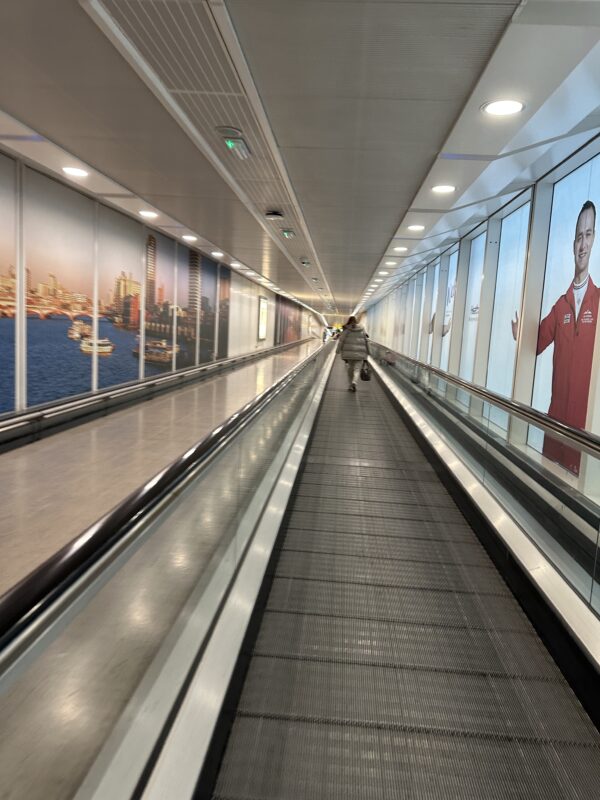 a person walking on a moving walkway