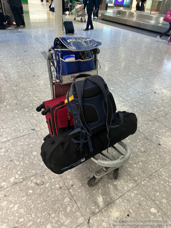 luggage on a cart at an airport