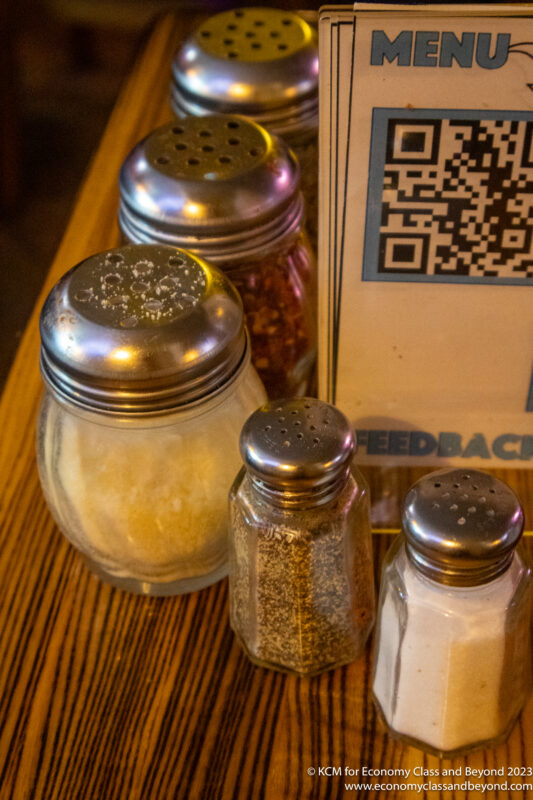 a group of salt and pepper shakers on a table