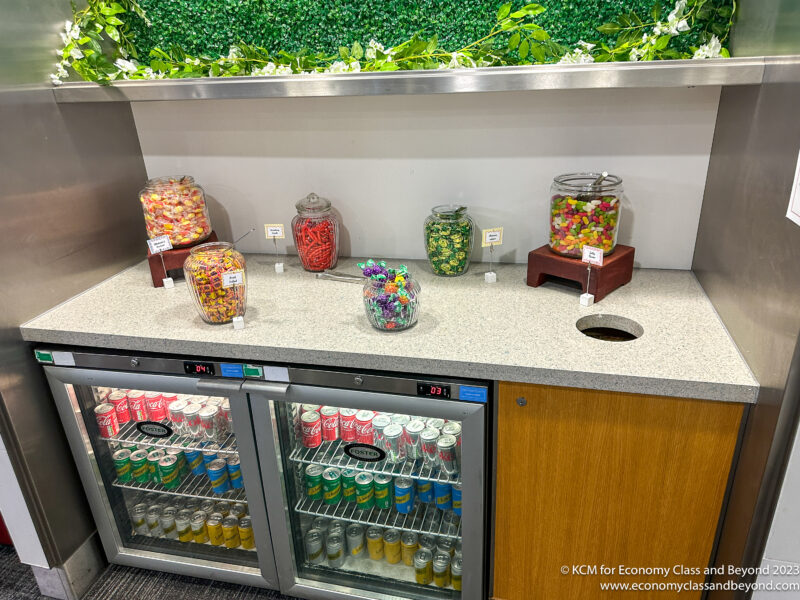 a candy bar with drinks and a display