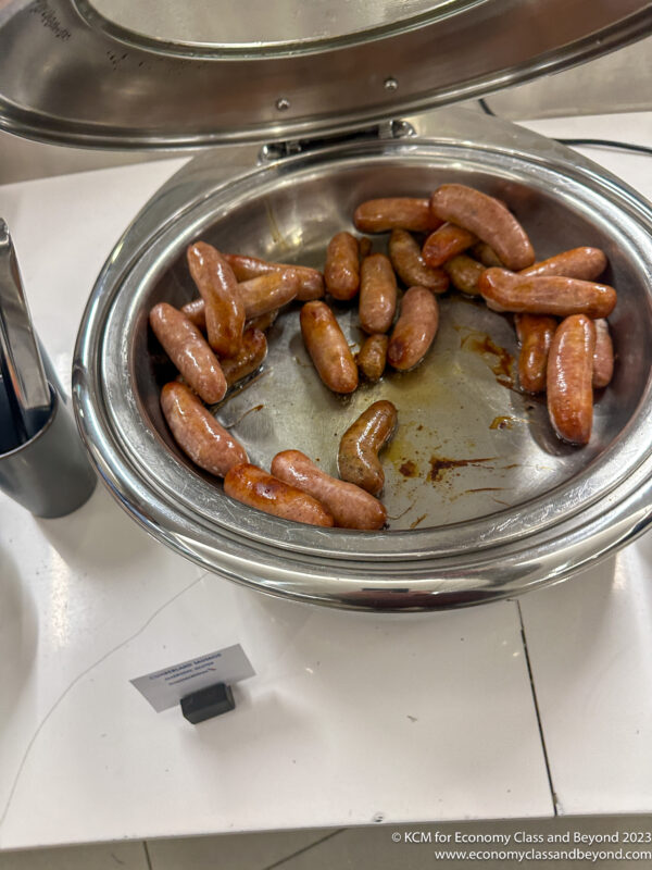 a bowl of sausages on a table