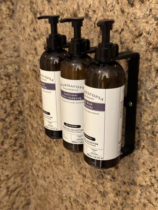 a group of bottles of shampoo on a wall