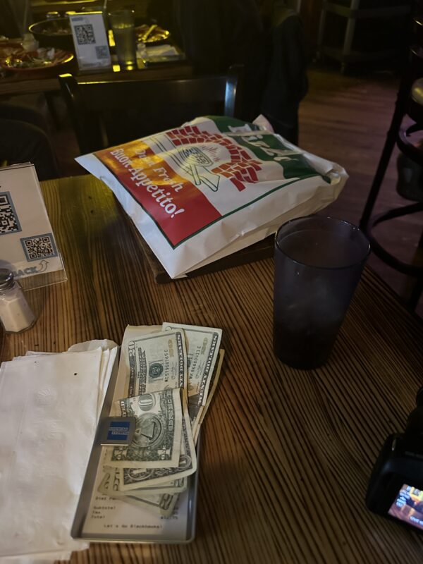 a bag of money on a table