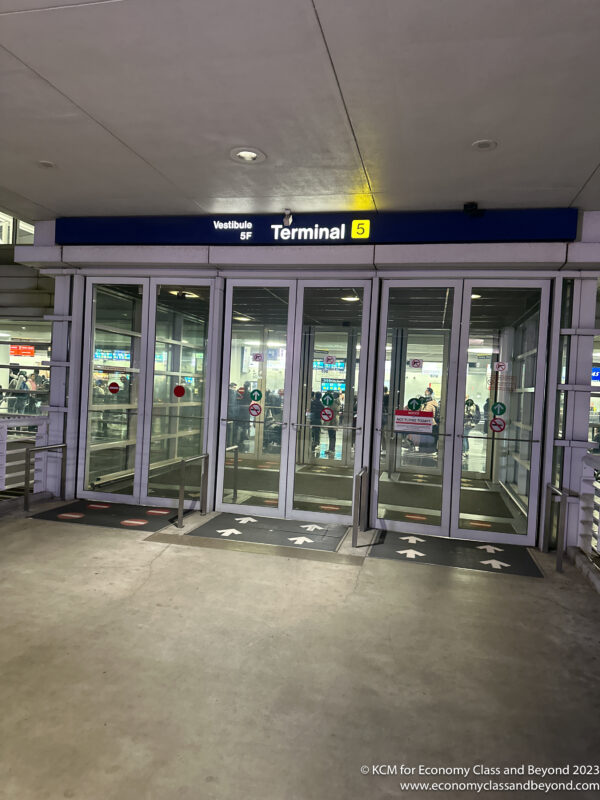 a glass doors with signs on the front