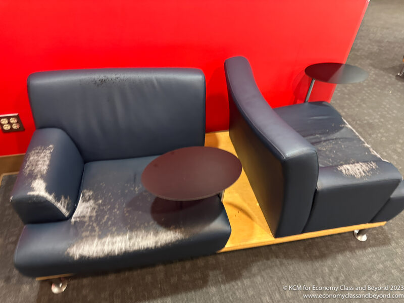 a couch and chair with a table