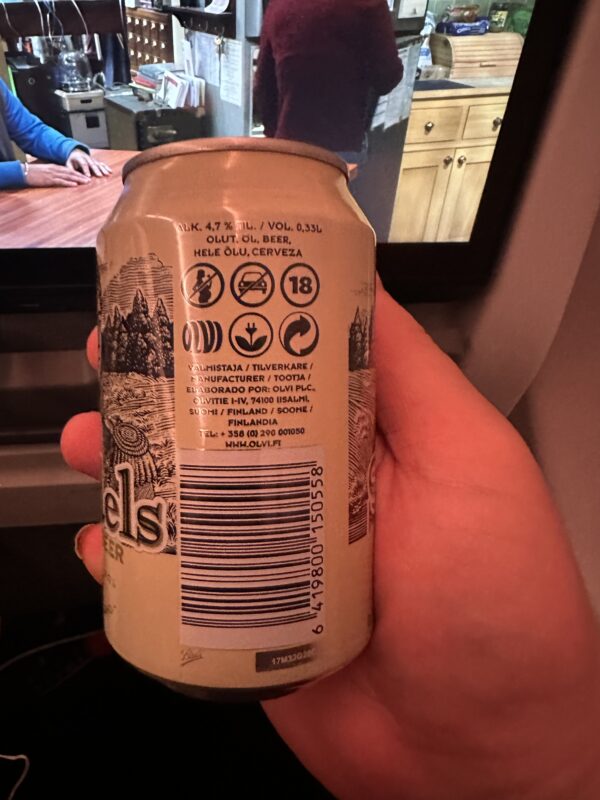 a hand holding a can of beer