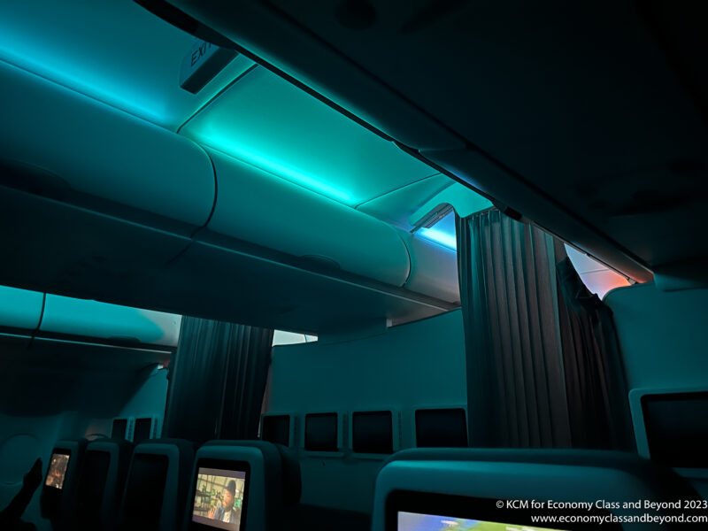 a blue light on the ceiling of an airplane