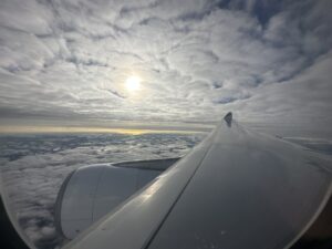 the wing of an airplane above clouds