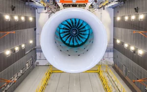 a large white engine in a factory