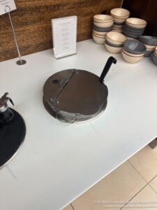 a metal pan on a white table