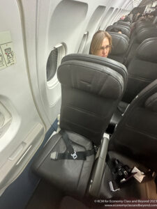 a woman sitting in a plane