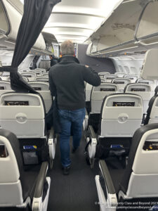 a man walking in an airplane