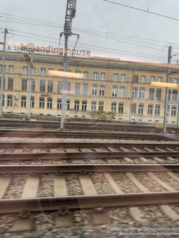 train tracks next to a building