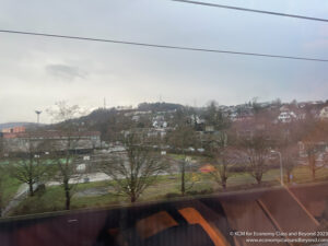 a view of a city from a train window