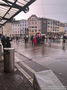 a group of people standing in a city street