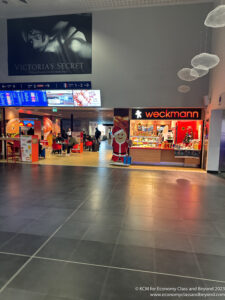 a large building with a large sign and a large santa claus figure