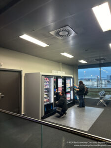 people standing in front of a vending machine