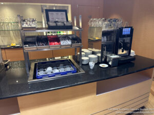 a coffee machine and utensils on a counter