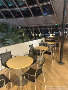 a table and chairs in a room with a glass dome ceiling