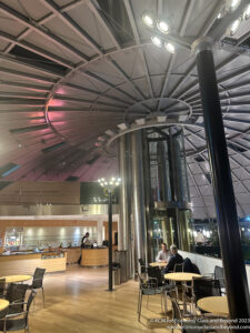 a group of people sitting at tables in a large room