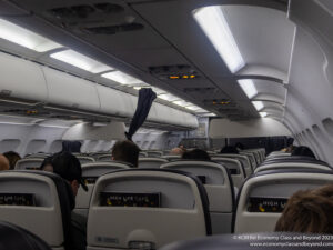 a group of people sitting in an airplane