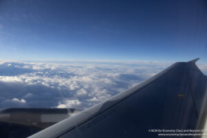 an airplane wing and clouds