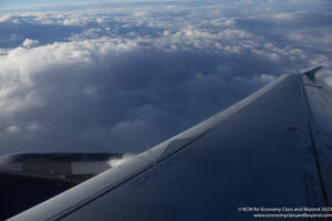 an airplane wing in the sky