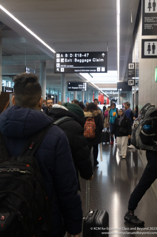 a group of people walking in a terminal
