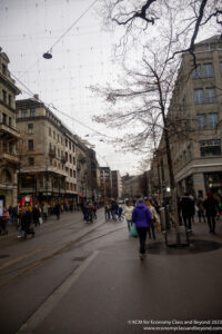 a group of people walking on a street