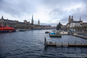 a body of water with buildings and boats