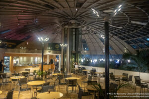 a large circular building with tables and chairs