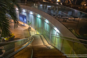 a staircase with glass railings