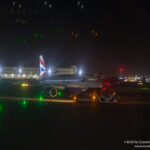 British Airways Airbus A320 being towed at Heathrow Airport at night