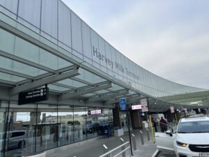 a building with a glass wall and a sign