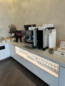 a coffee machine and cups on a counter