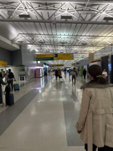 a group of people walking in a terminal