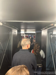 a group of people walking down a hallway