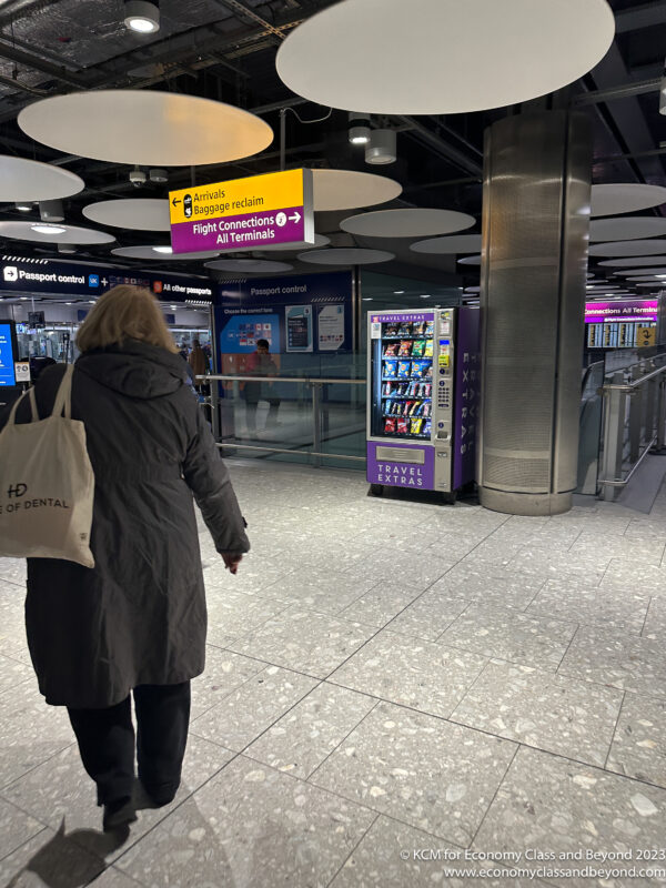 a woman walking in a terminal
