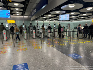 people walking through a check-in area