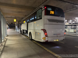 a white bus parked in a parking lot