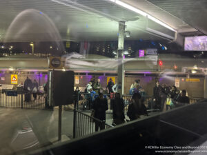 a group of people standing in a station