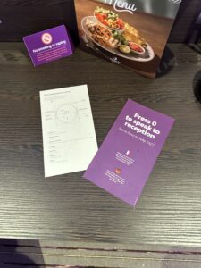 a table with a few papers and a box