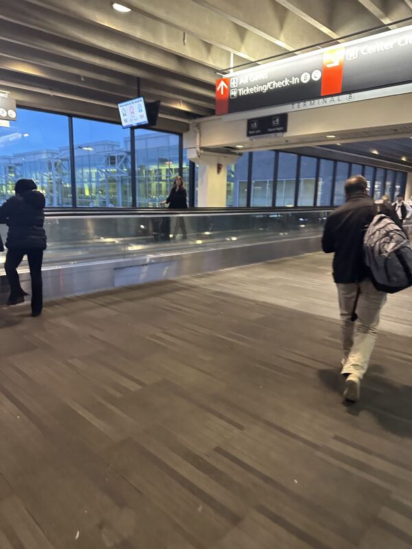 people walking in an airport