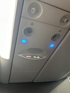 a overhead panel with lights and buttons