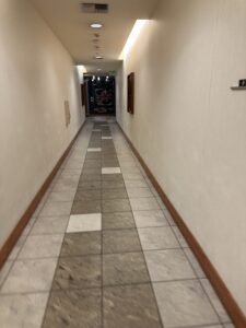 a long hallway with tile floor