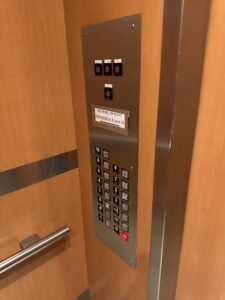 a elevator panel with buttons and switches