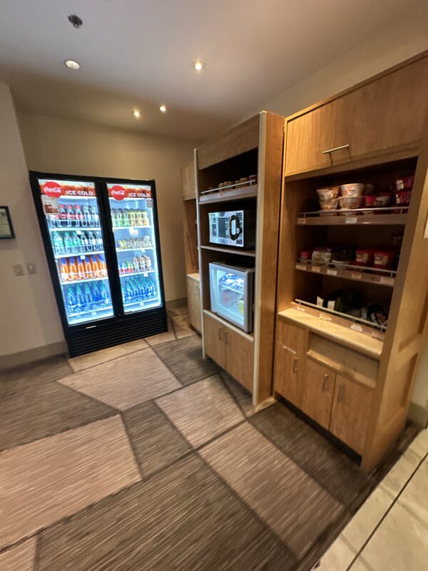 a room with shelves of food and drinks