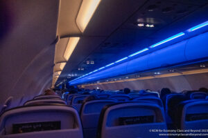an airplane with seats and a blue light