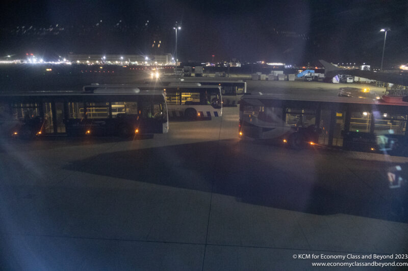 a group of buses at night