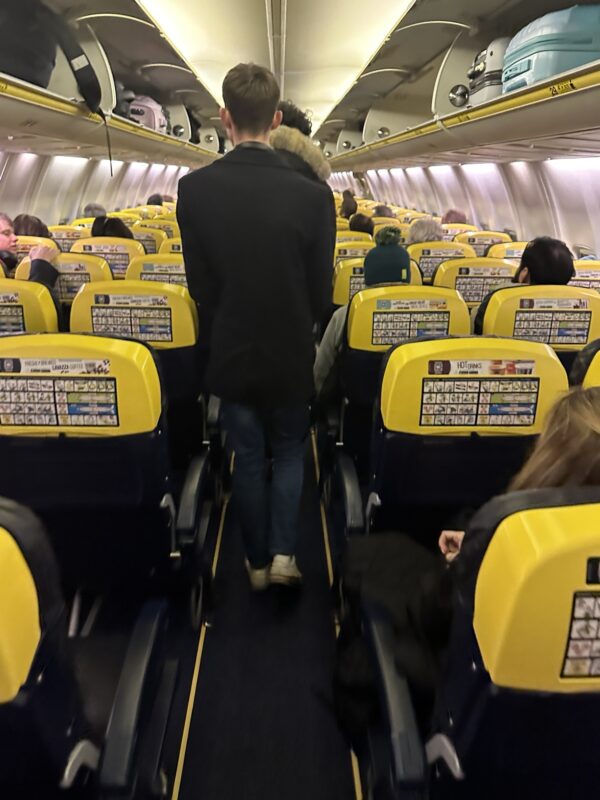 a man walking on an airplane
